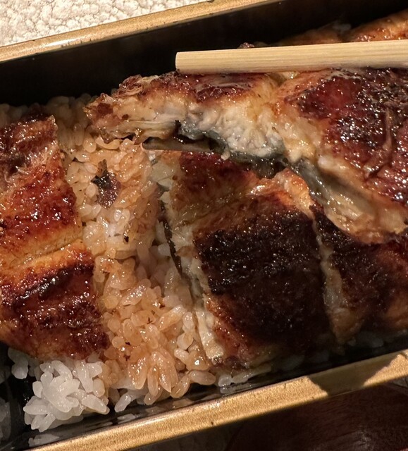 Inside the dazzlingly Asian-themed restaurant, enjoy grilled eel.